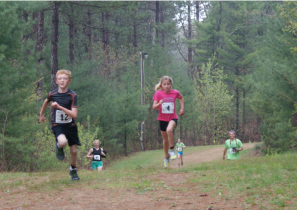2K winner Kyle Tennie chased by girls’ winner Madison Hohn.